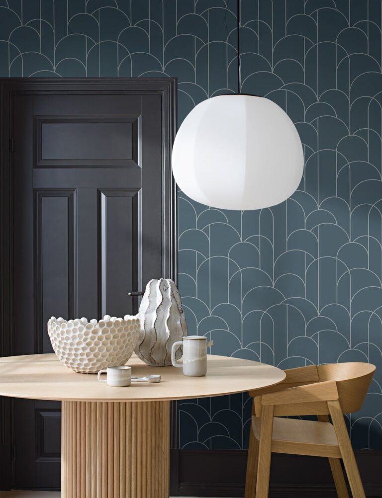 Dining room with blue wallpaper of arches