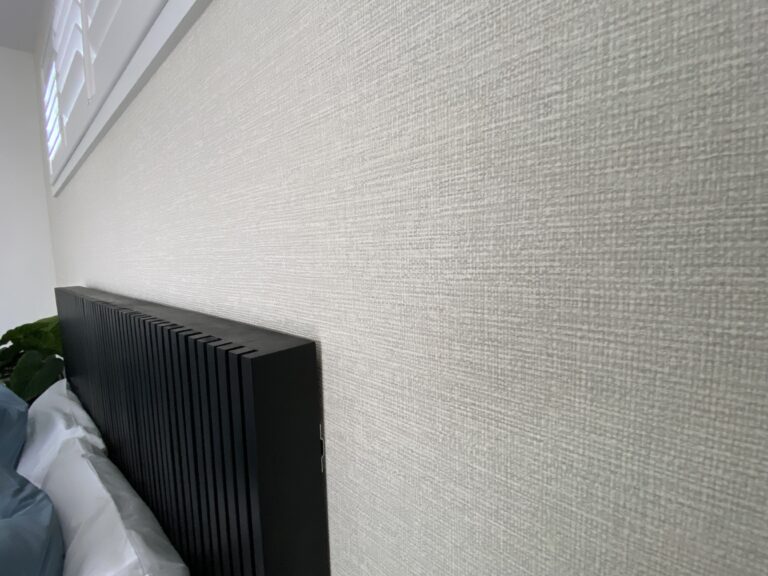 Textured wallpaper in grey in a bedroom