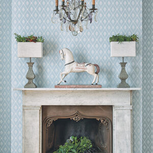 Alma wallpaper in blue - trellis pattern set around fireplace