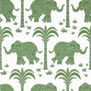 Elephants in green with palm trees feature in this wallpaper design by Thibaut