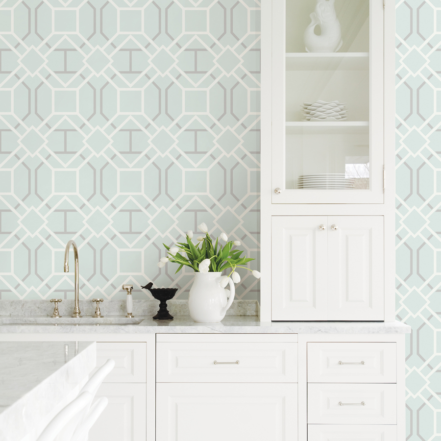 Pale green patterned wallpaper in a white kitchen for contrasting colours in a fresh modern look