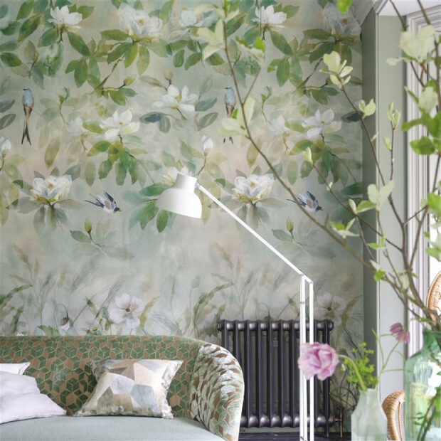 Close up shot of Designers Guild wallpaper of birds in leafy floral design