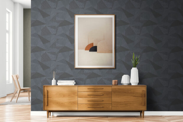 Feature wall idea of dark grey geomatric abstract wallpaper in a bright open interior room