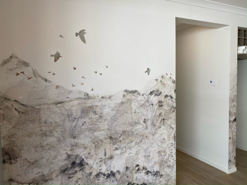 Mural of birds and mountains in a Brighton Homes display home