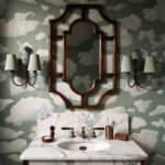 Cloud wallpaper on a sage green background in a toilet