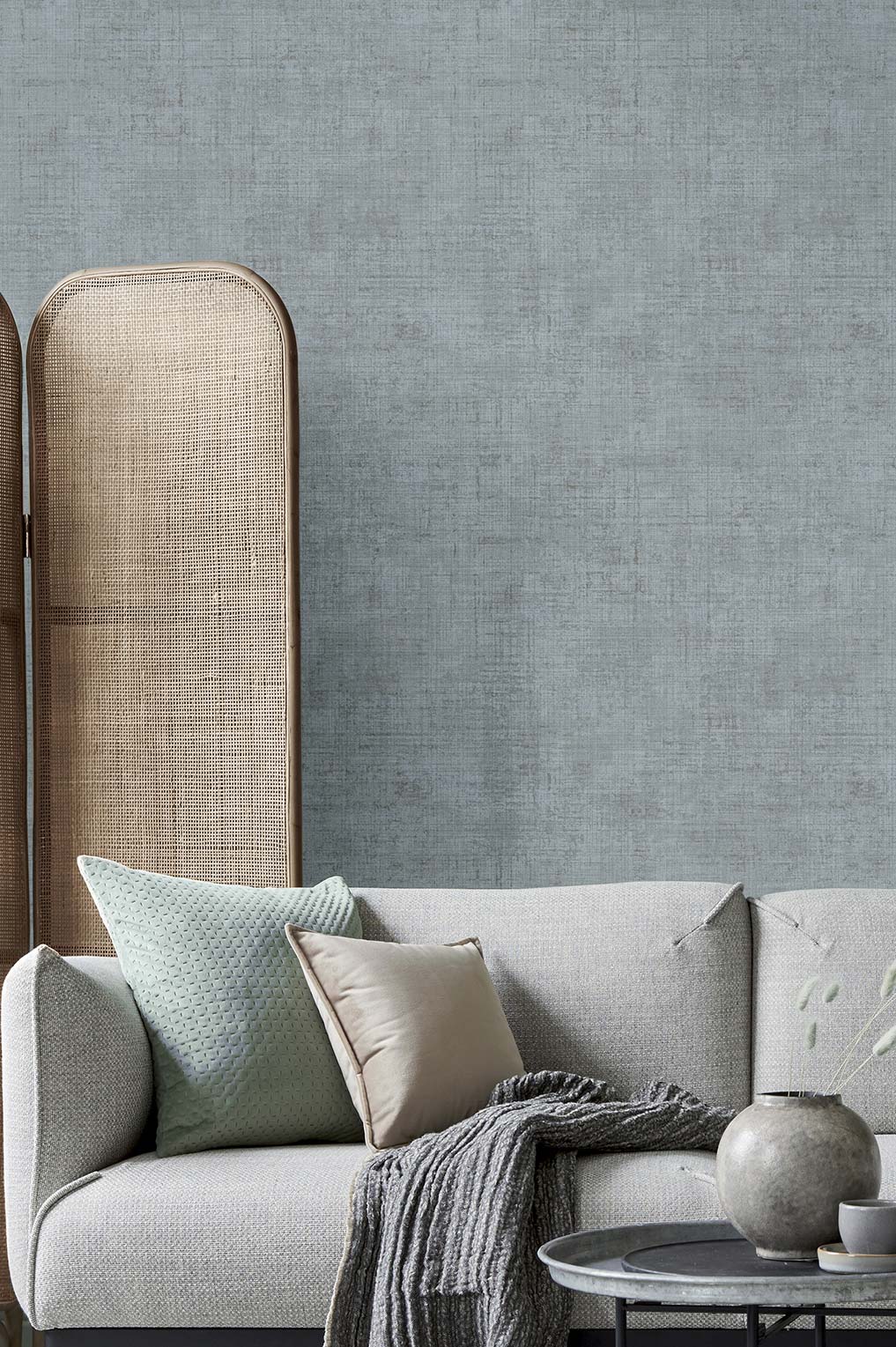 Textum Italian wallcoverings seen here is a plain blue textured fabric look in a living room