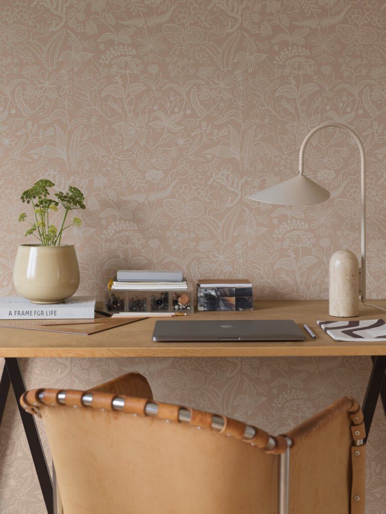 Mocha coloured illustration style wallpaper in a home office