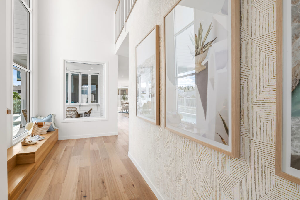 Entry wallpaper in a bright open living for Neptune Homes