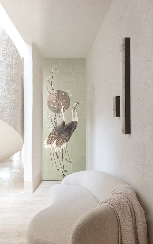 Crane wallpaper mural in soft green in Japanese style set in a minimalist room