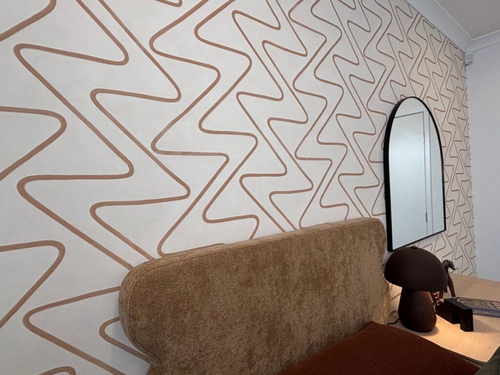 Zig zag feature wallpaper in beige and orange