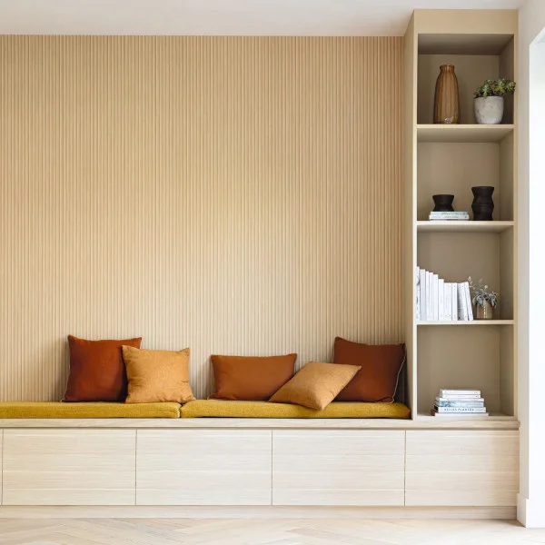 Drop zone or entry niche wallpapered in a timber effect wallpaper in thin stripes
