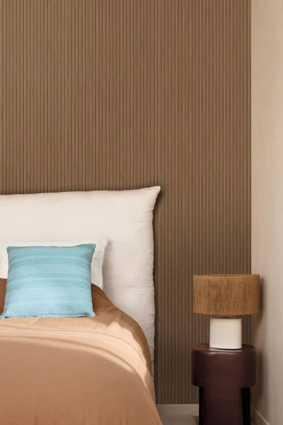 Brown timber battons in a bedroom that is actually wallpaper