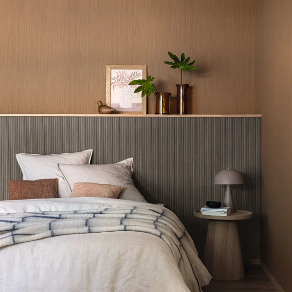 Bushel timber look wallpaper used as a bedhead in a modern bedroom