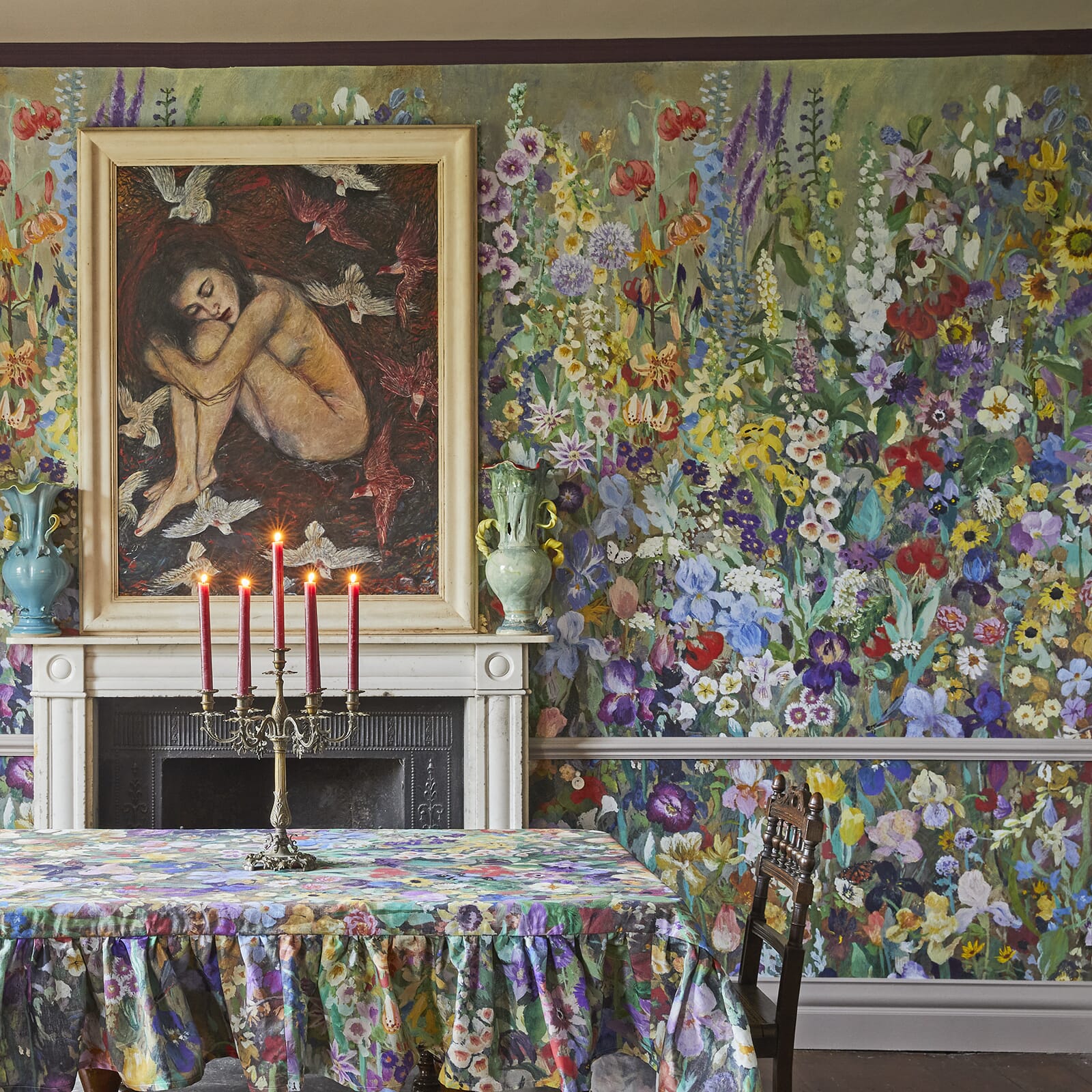 An eclectic dining room featuring watercolour style floral wallpaper