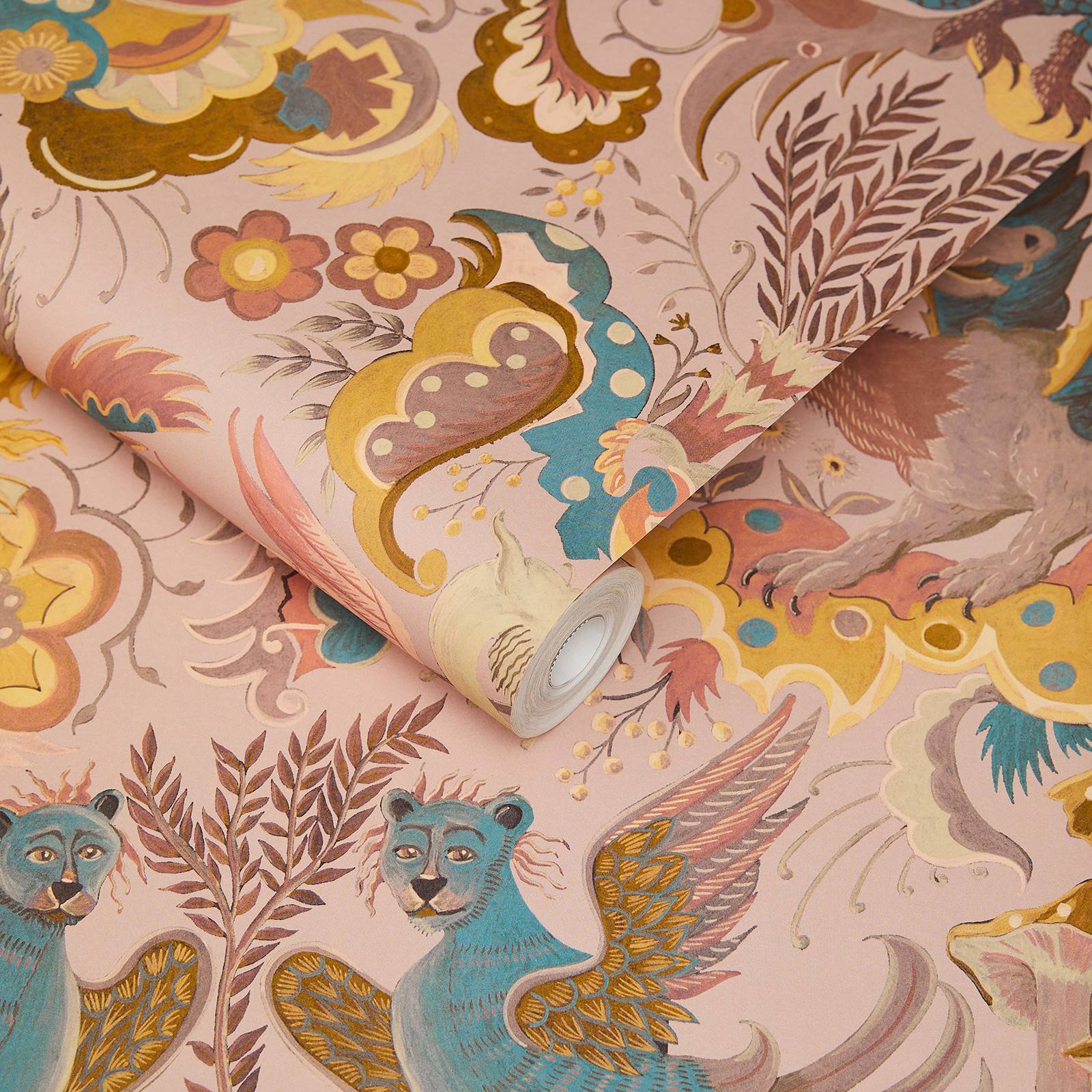A roll of soft pink wallpaper with fun dragons and beasts on clouds