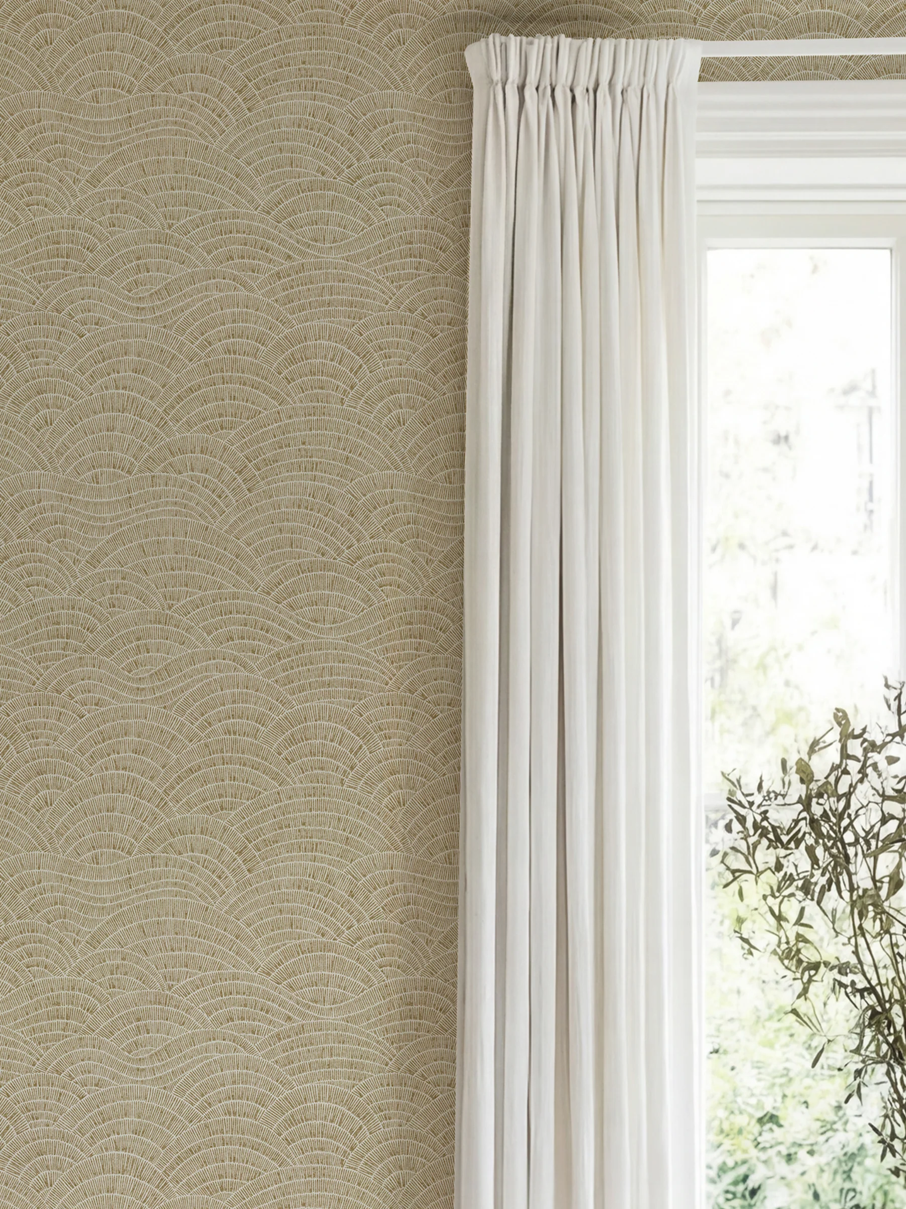Dalty sand wallpaper of flowing arcs next to white sheer curtains