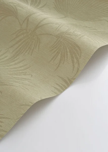 A roll of pistachio green tropical wallpaper