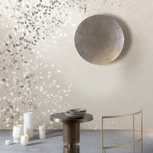 Climber in Porcelain silver is a mural of trailing leaves seen her in a ultra contemporary room with minimalist furnishings