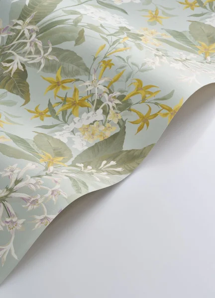 A roll of pale green and yellow floral wallpaper