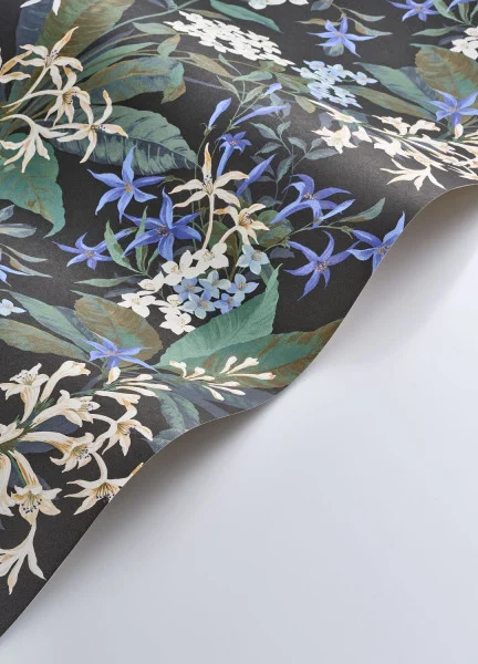 A roll of ink blue Jasmine Dream wallpaper