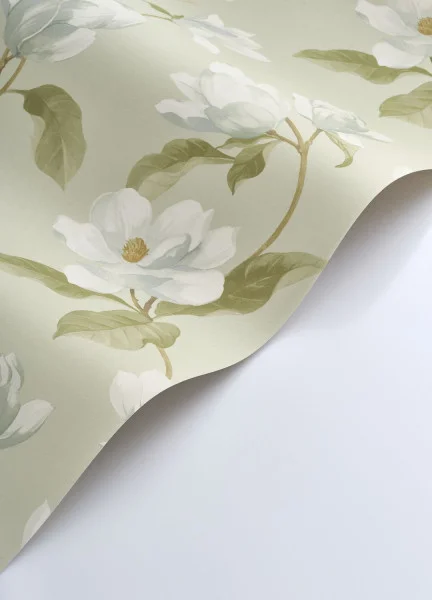A roll of green Magnolia Mist wallpaper