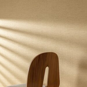 Mori textured wallpaper in honey gold seen in a light filled room