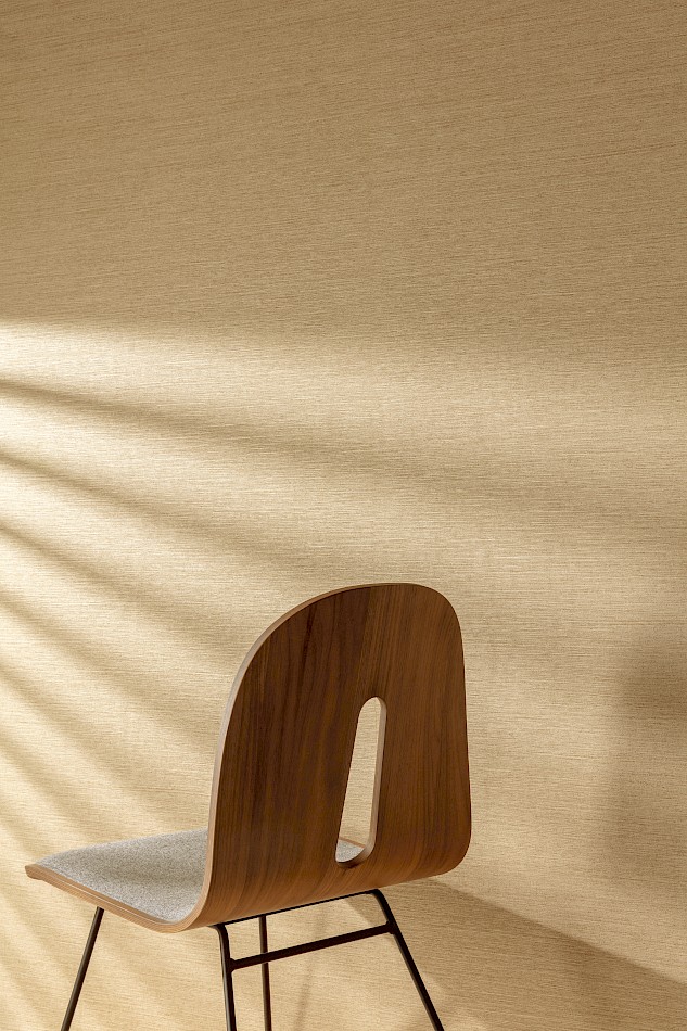 Mori textured wallpaper in honey gold seen in a light filled room