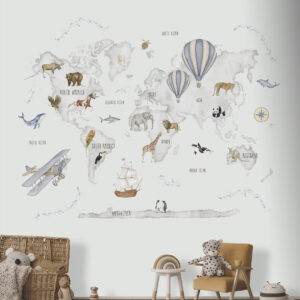 A childs nursery with a playful world map mural