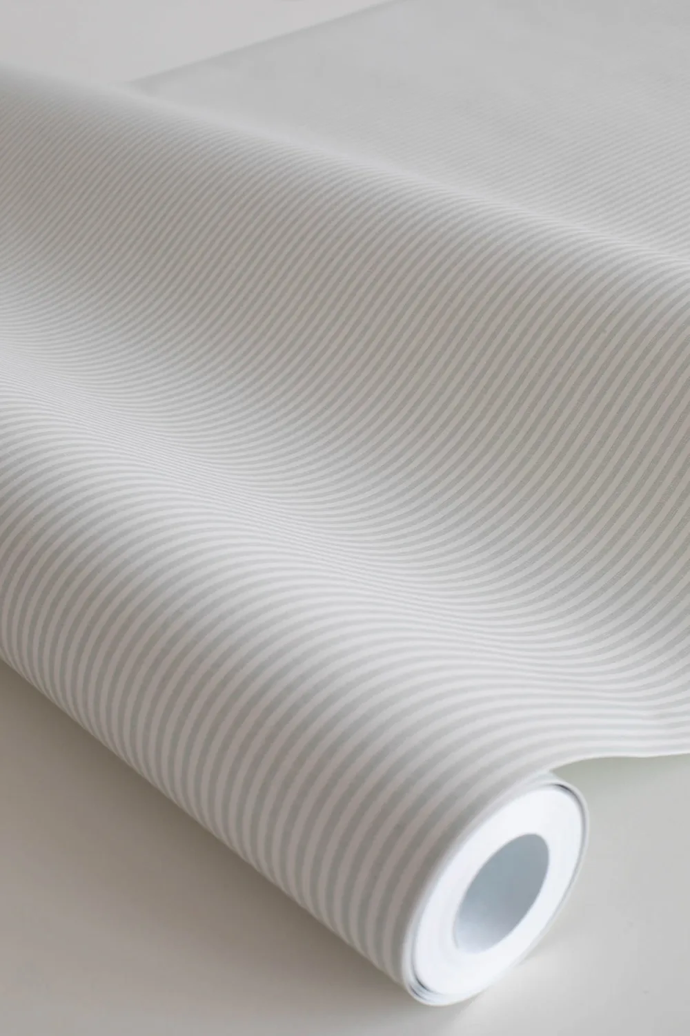A roll of Rand thin stripy wallpaper
