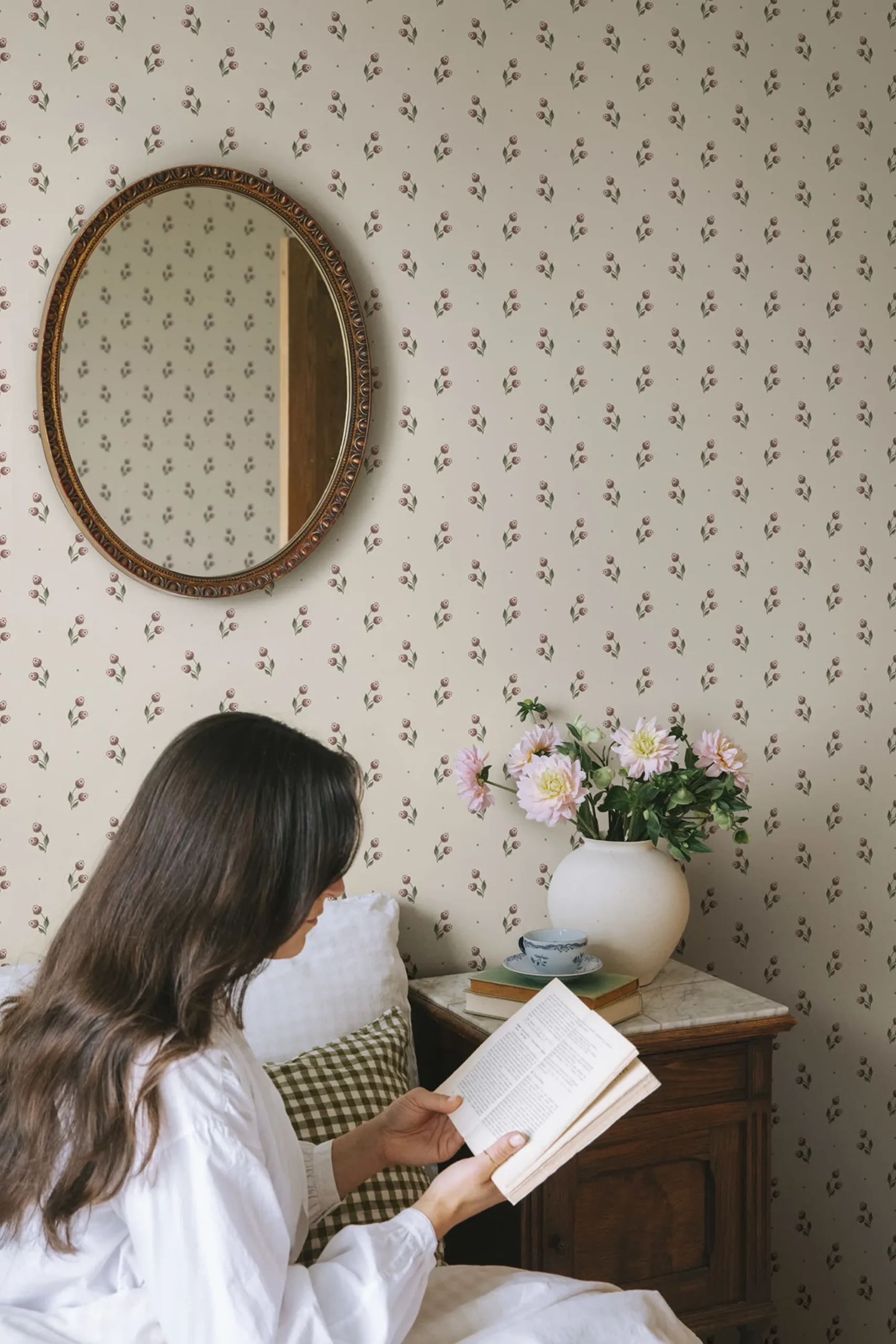 Bedroom with lady featuring Siv small repeating patterned wallpaper