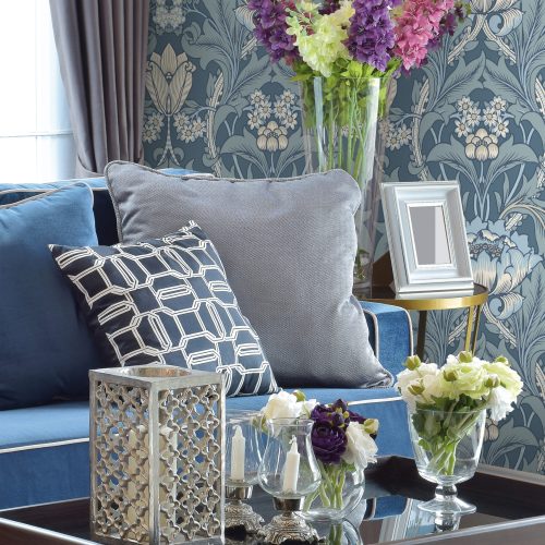 large flower blue wallpaper in traditional style. Classical looking living room setting